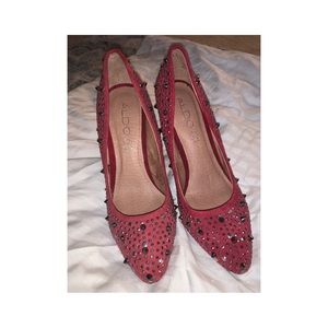 Red Spiked Pumps